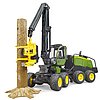 Abatteuse John Deere 1270G avec 1 tronc d'arbre