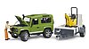 Land Rover Defender Station Wagon mit Einachsanhänger, JCB Mikrobagger 8010 CTS und Bauarbeiter